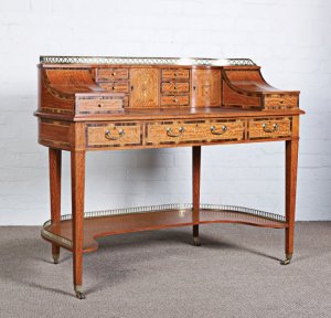 A fine Victorian satinwood and calamander crossbanded Carlton House Desk