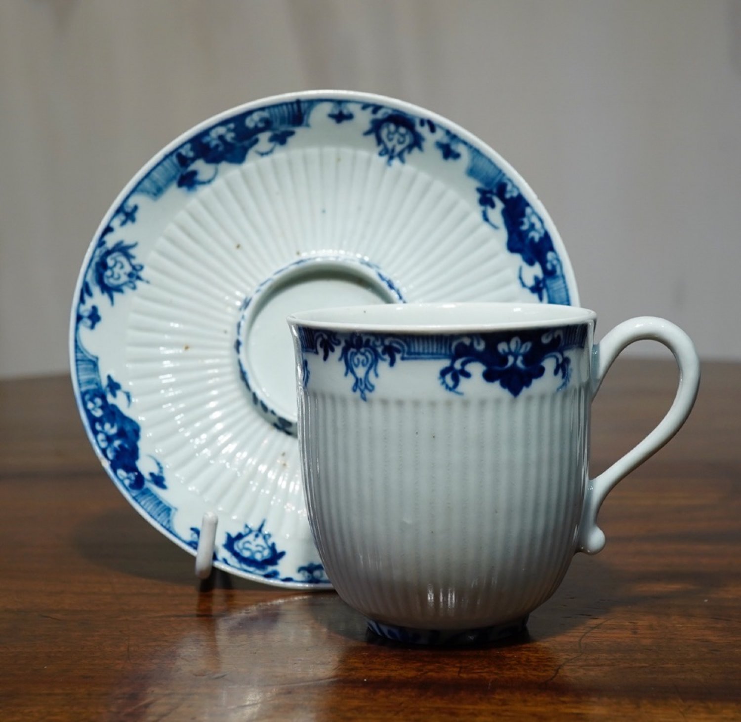 Worcester cup & saucer, 'French' style- ribbed form with blue Lambrequins, c. 1756 