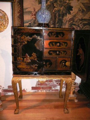 A fine Japanese lacquered chest on gilt stand.