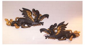 402 A pair of carved wood, painted and gilded   mythological dragons,  