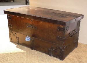 889  A rare walnut strong box with shaped iron adornments