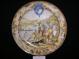   1051   A Majolica charger depicting an army resting by a river