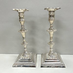 A Fine Pair of George III Sheffield Plate Crested Candlesticks