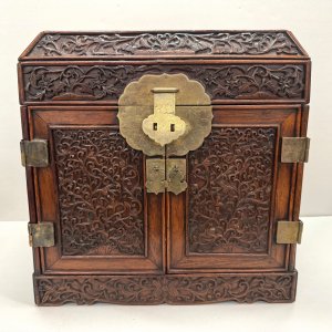 A Rare Early Qing Dynasty Floral Carved Huang Hua Li Cabinet