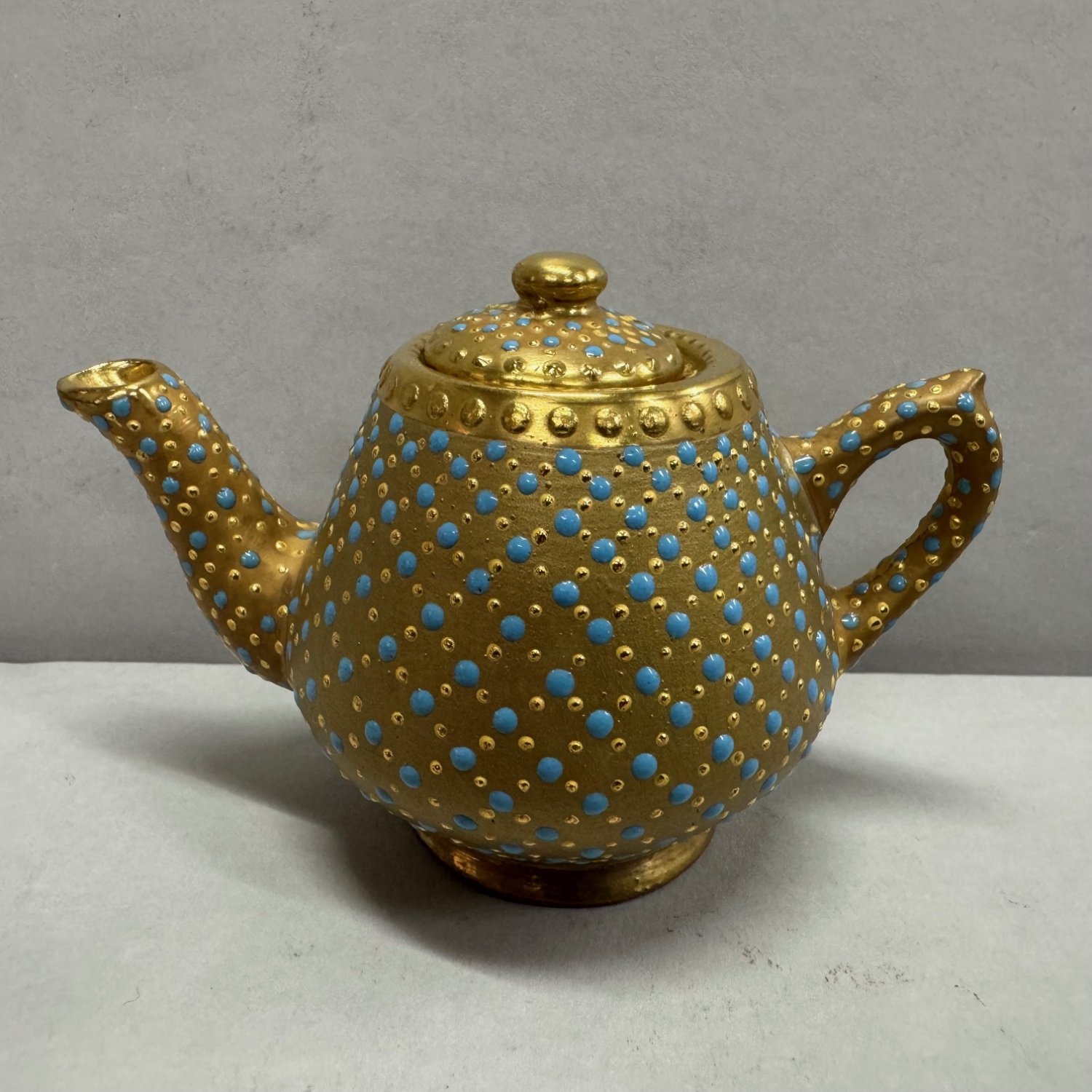 A Ken Russell Gilt and Turquoise Jewelled Miniature Teapot 