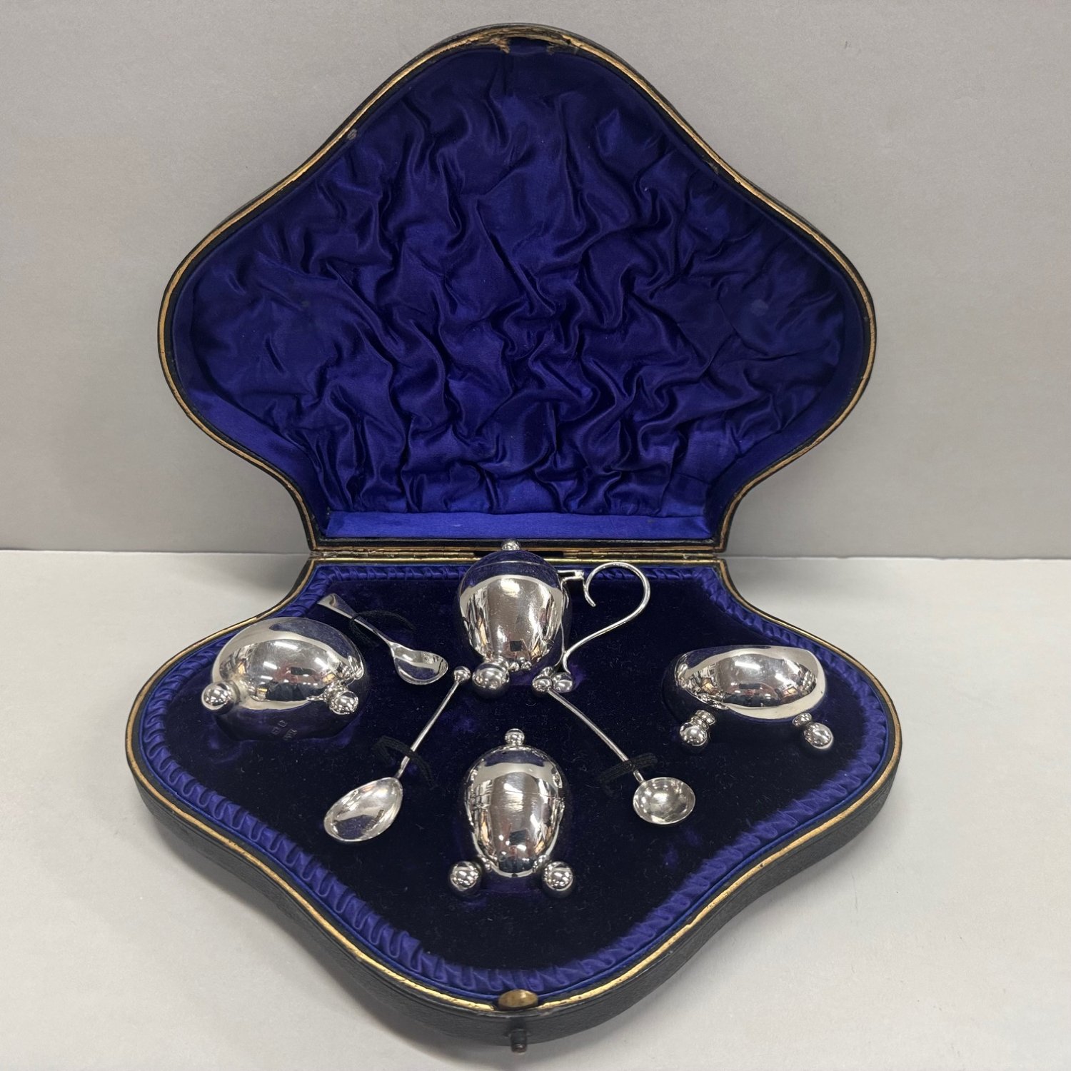 A Sterling Silverboxed 4 piece Salt, Pepper and Mustard Pot Setting