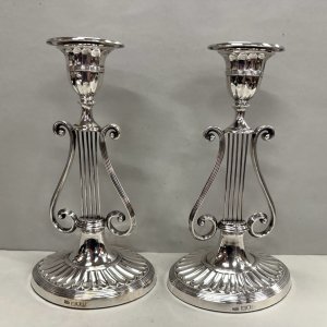 A Fine Pair of Sterling Silver Lyre Shape Candlesticks