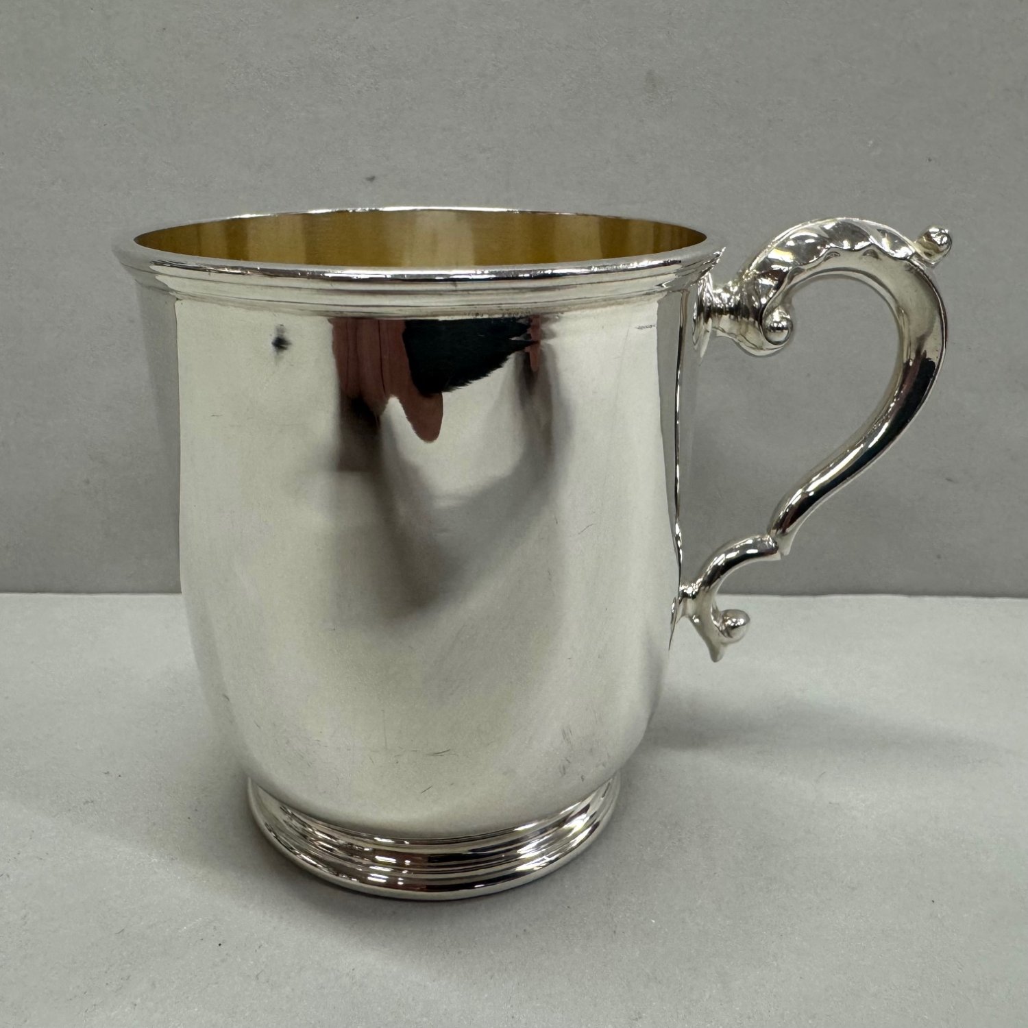 A Heavy Sterling Silver Scroll Handle Child's Mug