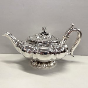 A George III Sterling Silver Melon Shape Footed Teapot