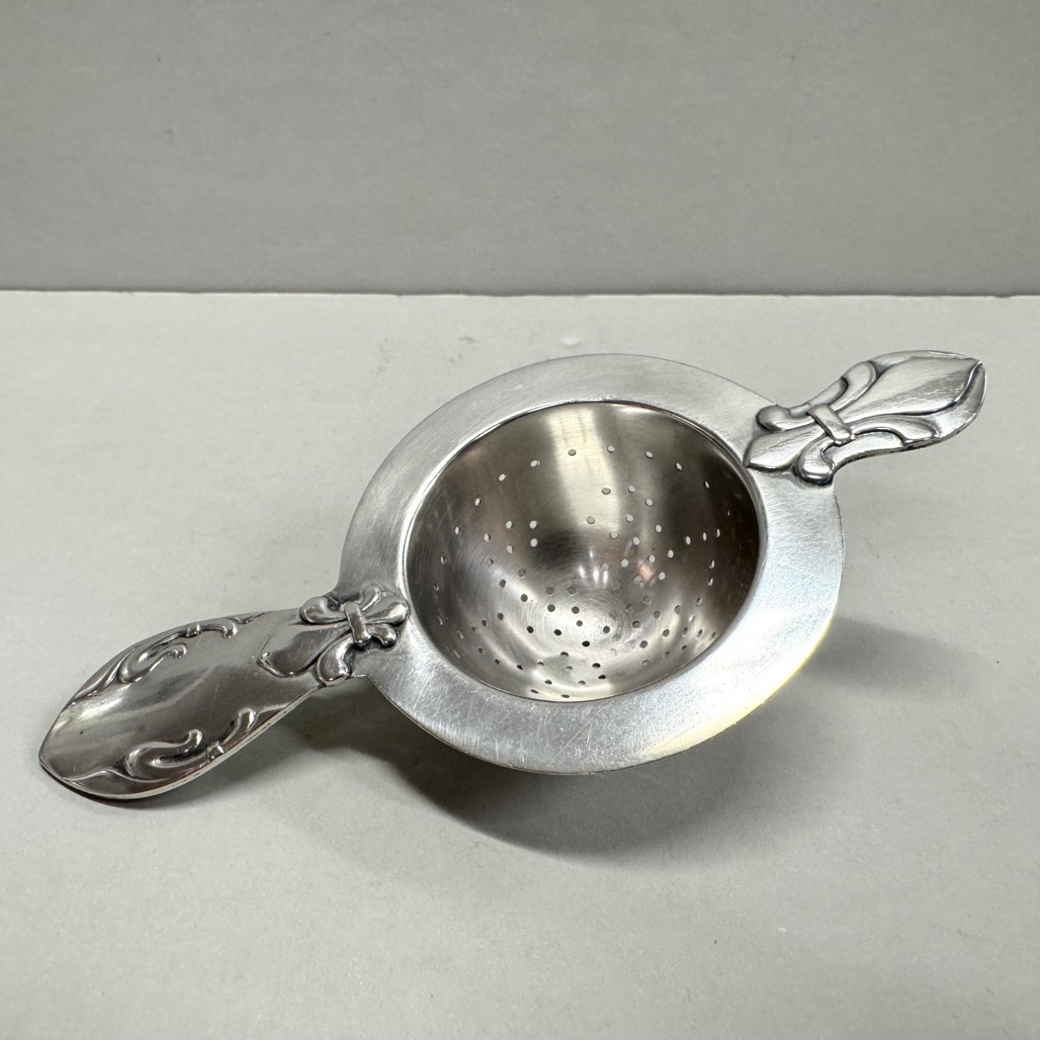 A Danish Sterling Silver Tea Strainer