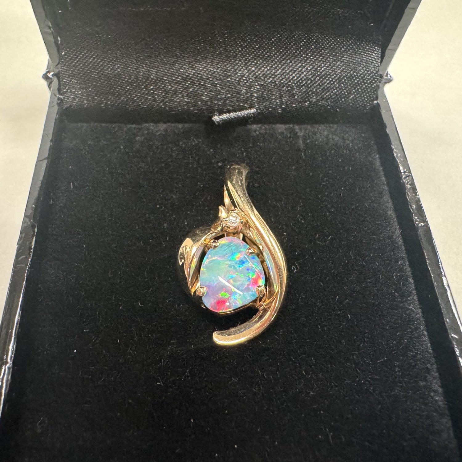 A 14ct. Gold Opal and Diamond pendant. 