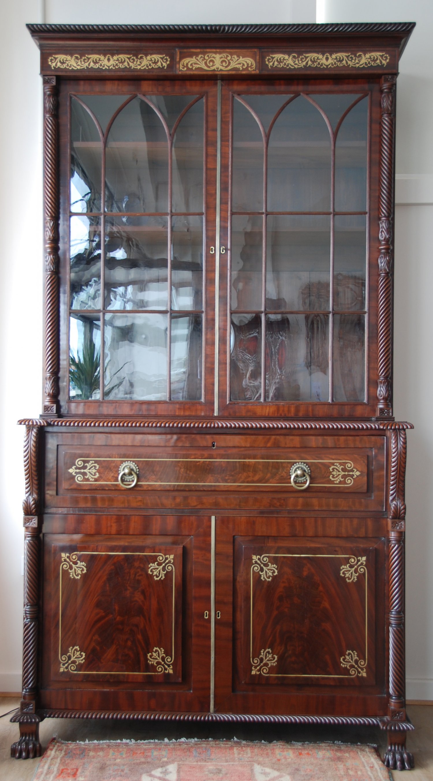 A fine Irish Regency period brass inlaid mahogany secretaire bookcase c1820, most probably from Cork.