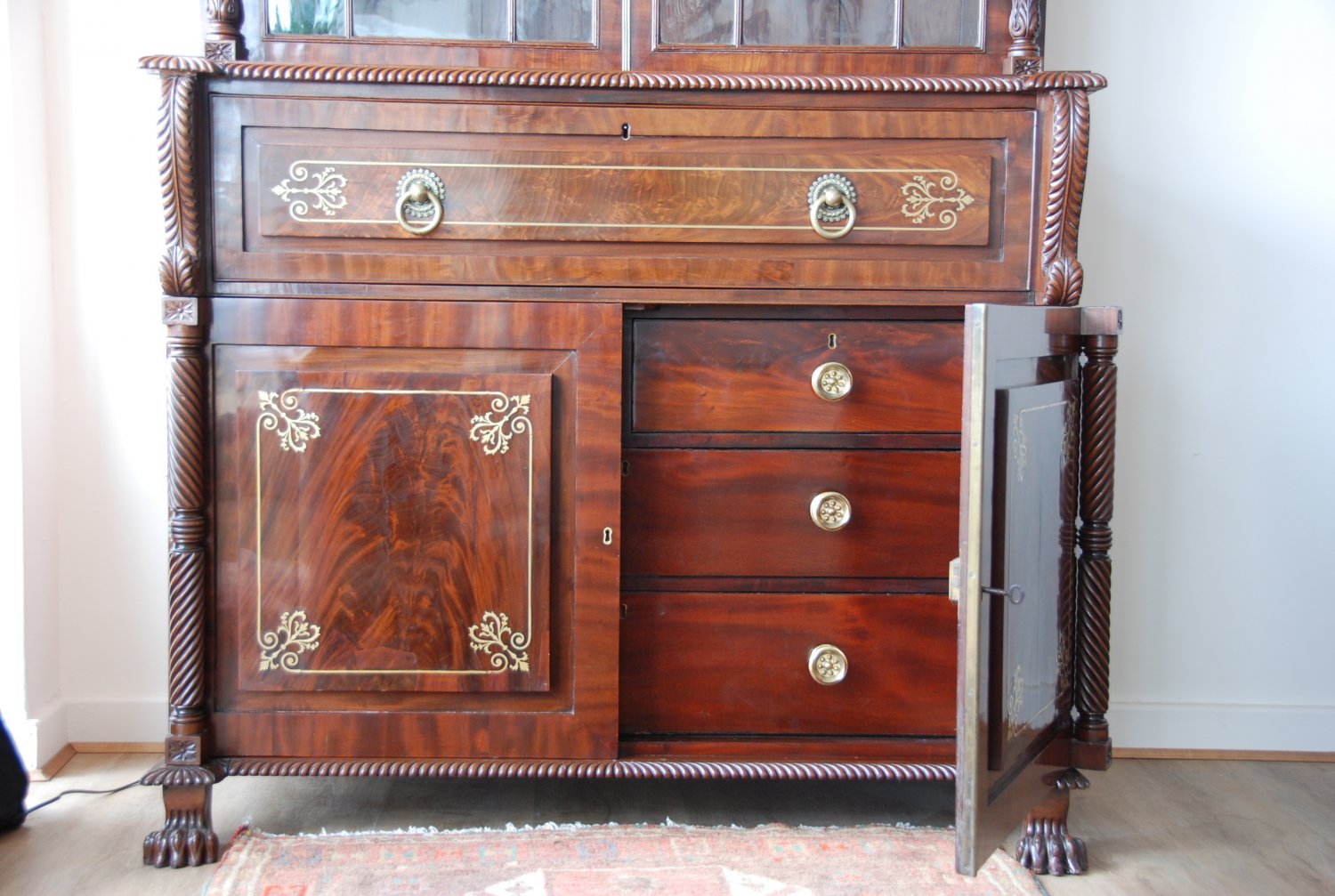 A fine Irish Regency period brass inlaid mahogany secretaire bookcase c1820, most probably from Cork.