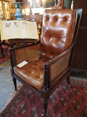 Rare, Regency period caned mahogany library armchair, with its original adjustable reading slope c1815