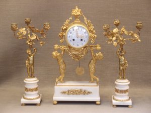French Louis XVI Style Clock Garniture in Ormolu and White Marble.
