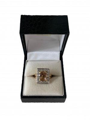 18ct Gold Oval Peach Topaz Ring, with 14 Brilliant Cut Diamonds.