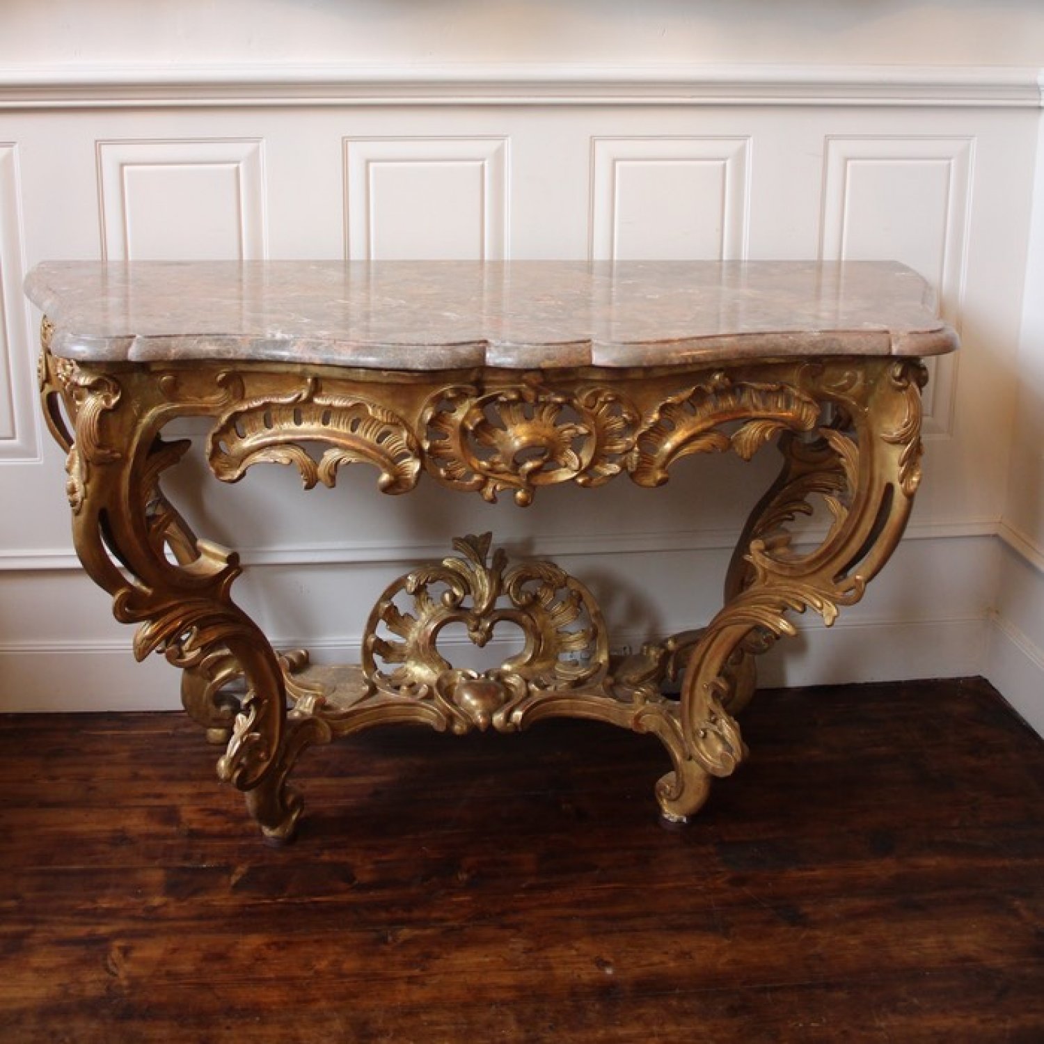 AN 18TH CENTURY, LOUIS XV PERIOD ARC-EN-ARBALÈTE, GILTWOOD CONSOLE TABLE. CIRCA. 