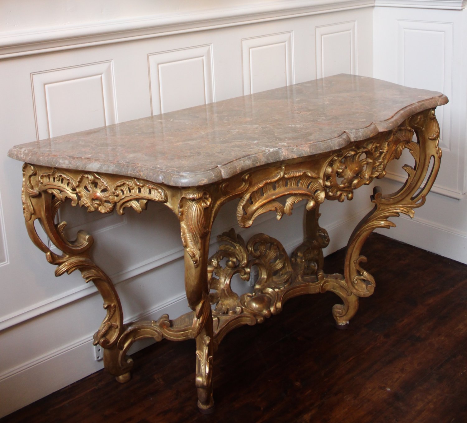 AN 18TH CENTURY, LOUIS XV PERIOD ARC-EN-ARBALÈTE, GILTWOOD CONSOLE TABLE. CIRCA. 
