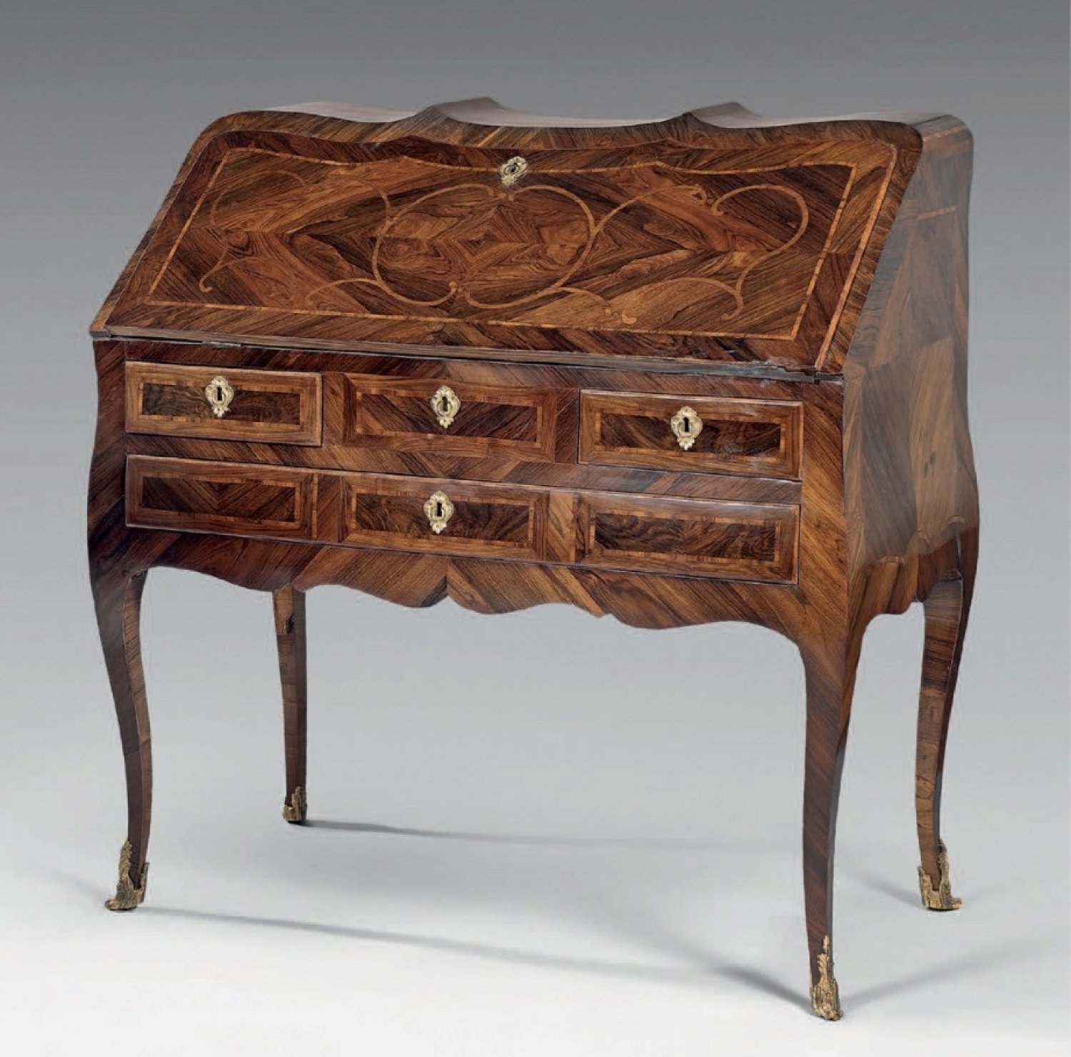 AN 18th CENTURY  LOUIS XV PERIOD, KINGWOOD AND BOIS SATINE, SERPENTINE SHAPED, BUREAU DE PENTE. BY PIERRE MIGEON.  CIRCA.