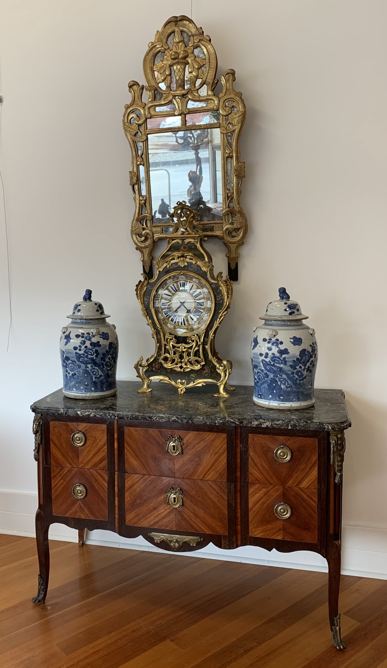 AN 18TH CENTURY LOUIS XV/XVI TRANSITIONAL ORMOLU-MOUNTED MAHOGANY, ROSEWOOD AND KINGWOOD COMMODE, BY ETIENNE AVRIL. CIRCA