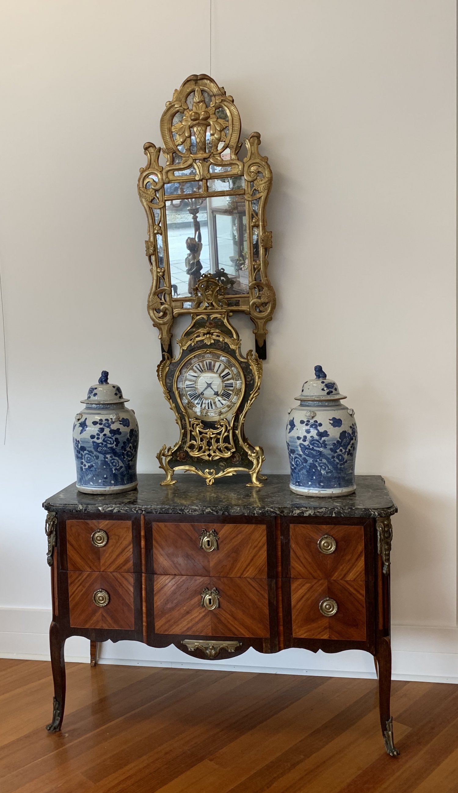 AN 18TH CENTURY LOUIS XV/XVI TRANSITIONAL ORMOLU-MOUNTED MAHOGANY, ROSEWOOD AND KINGWOOD COMMODE, BY ETIENNE AVRIL. CIRCA