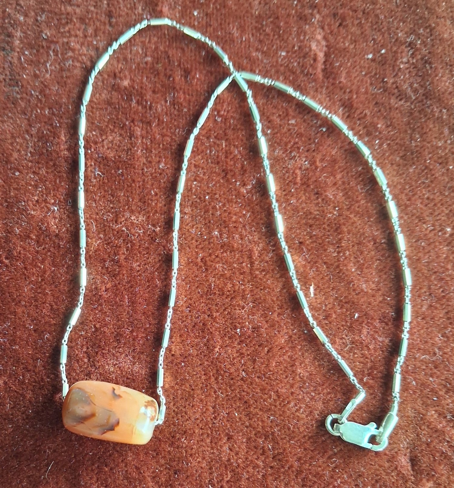 A silver chain necklace with a fine antique agate bead