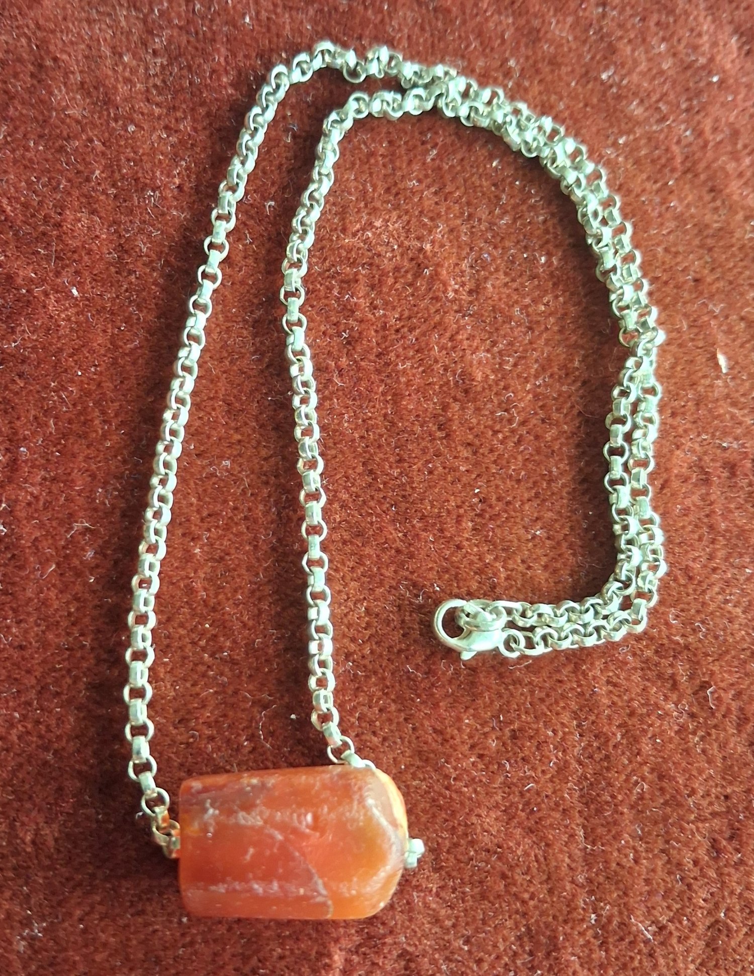 A silver chain necklace with a fine antique Carnelian  bead