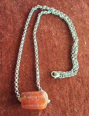 A silver chain necklace with a fine antique Carnelian  bead