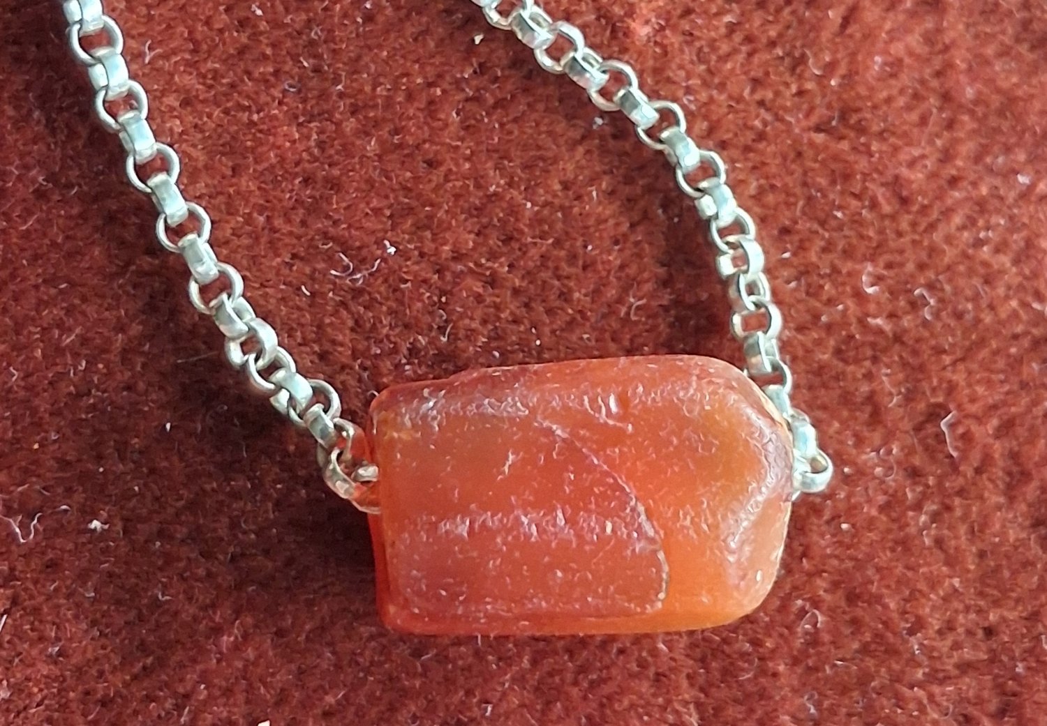 A silver chain necklace with a fine antique Carnelian  bead