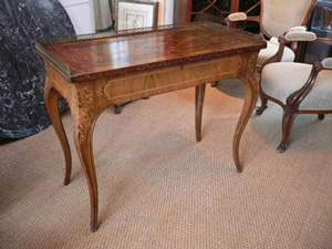 A walnut marquetry inlaid Table