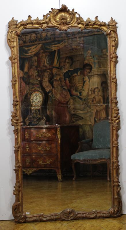 AN EARLY 18TH CENTURY, REGENCE GILTWOOD MIRROR.