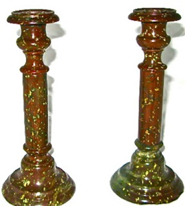 Pair of red porphyry candle sticks